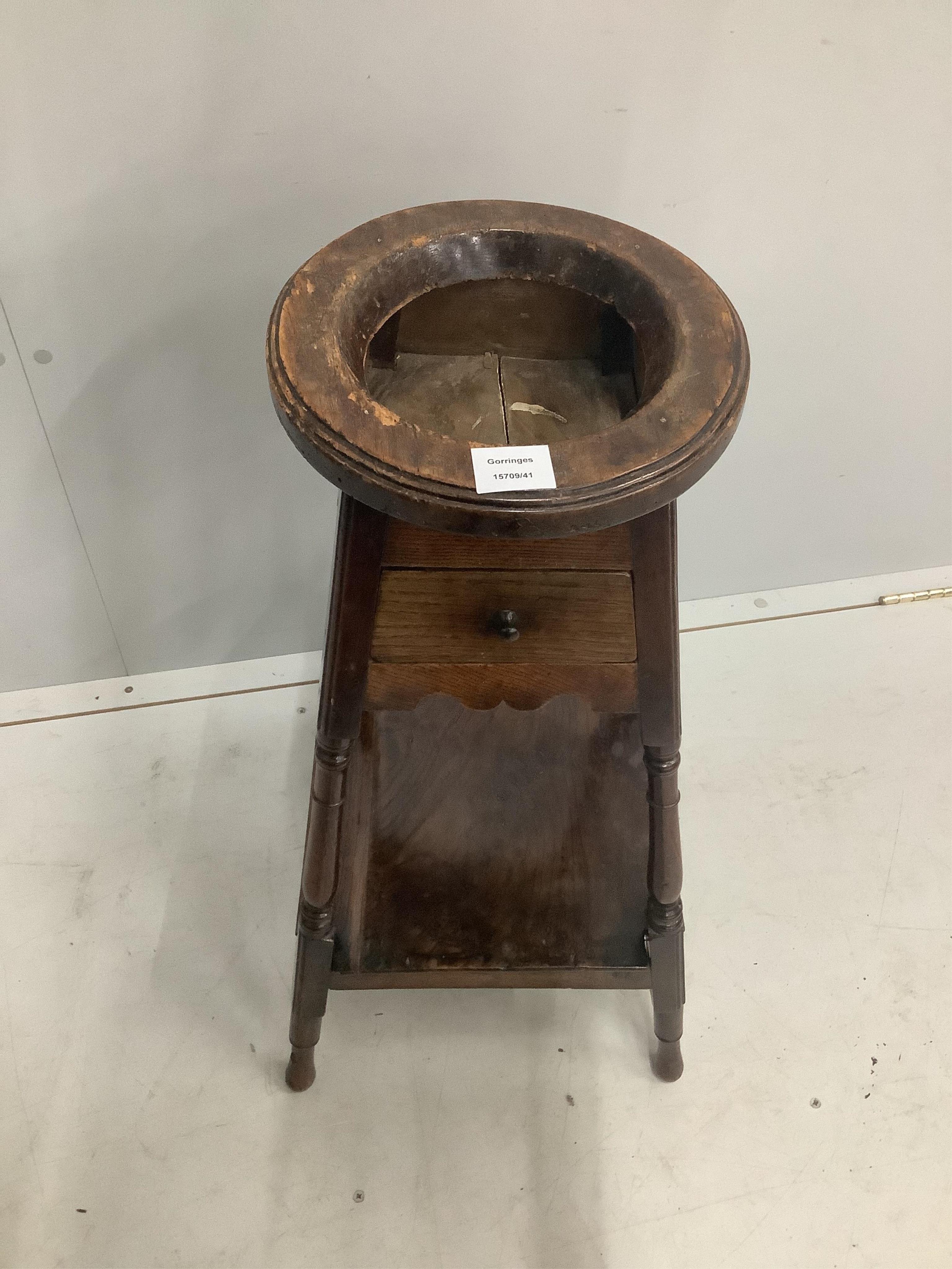 An early 18th century elm and walnut wig stand, height 74cm. Purchased from Mallett & Son of New Bond St., 15th March 1954 for £45. Condition - worming to the top and other wear, but overall fair